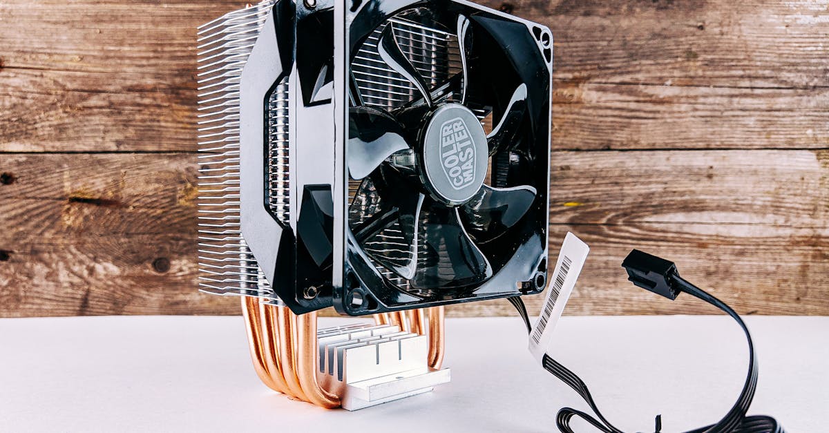 Detailed close-up of a CPU cooling fan and heatsink on wooden background, highlighting modern technology.